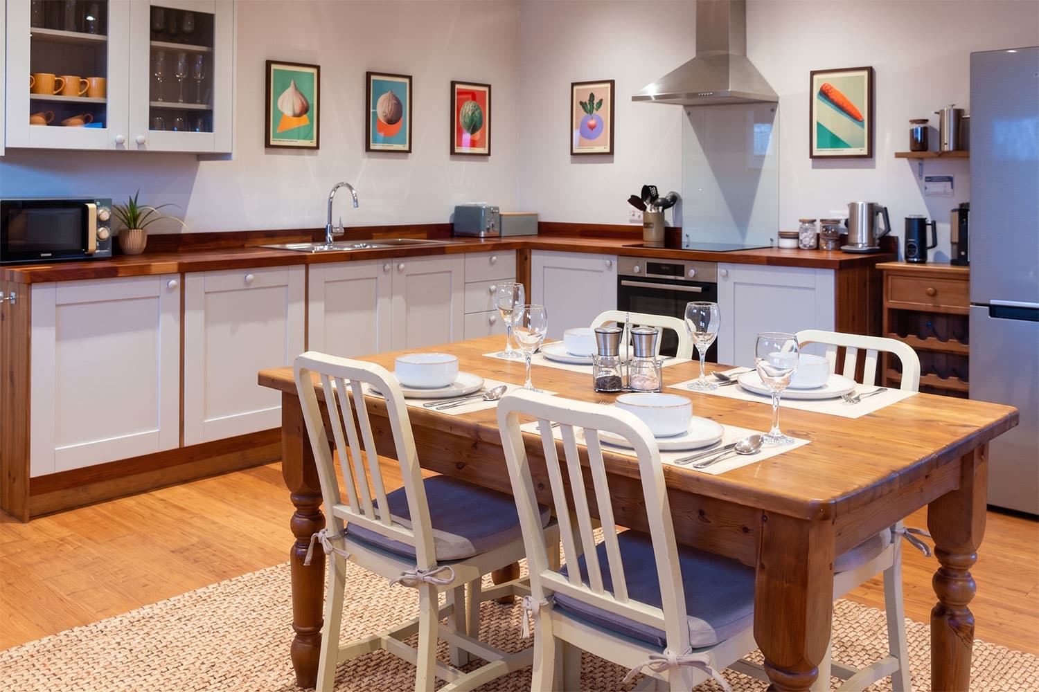 Prepare meals in this well-equipped kitchen featuring modern appliances, a dining table and thoughtful provisions